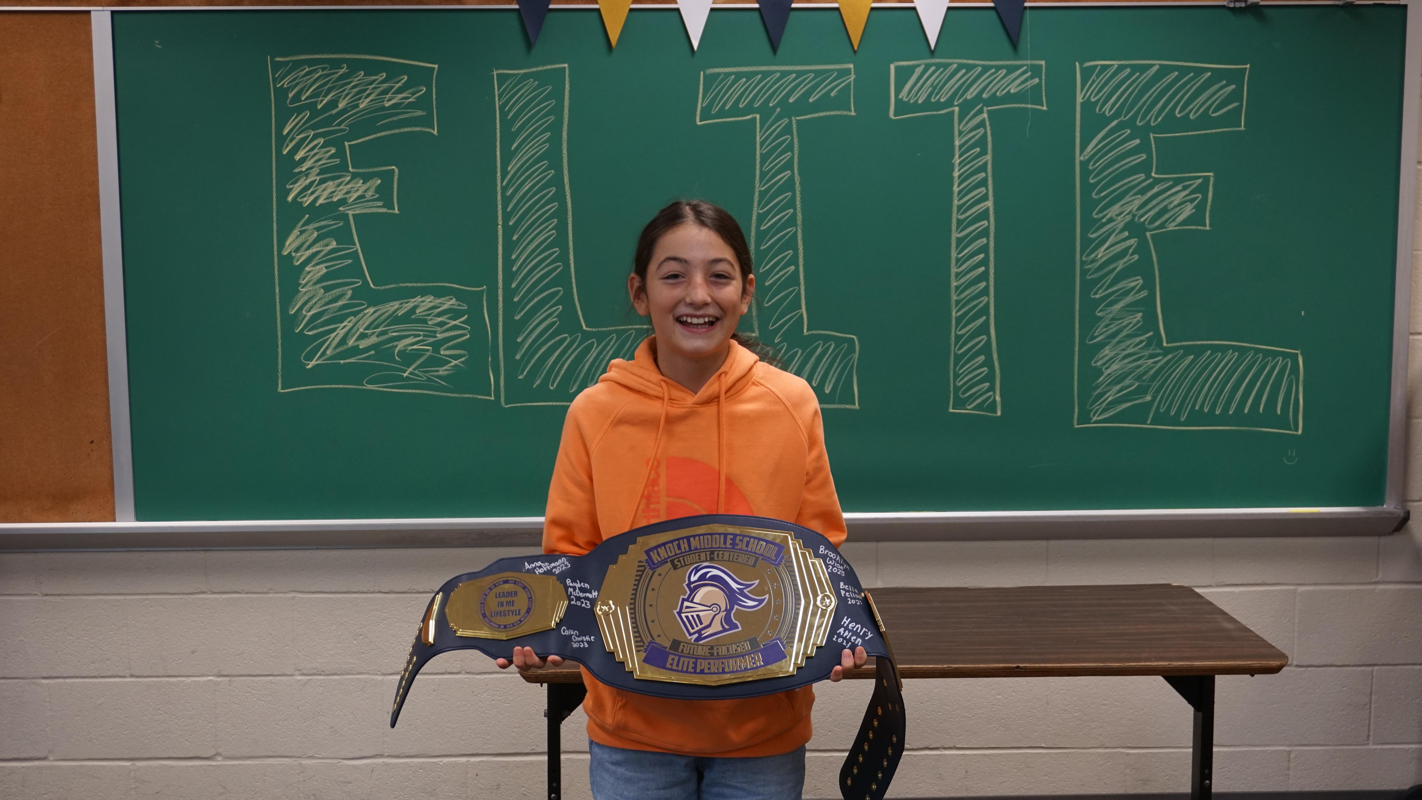 pic of a girl with a huge prize belt