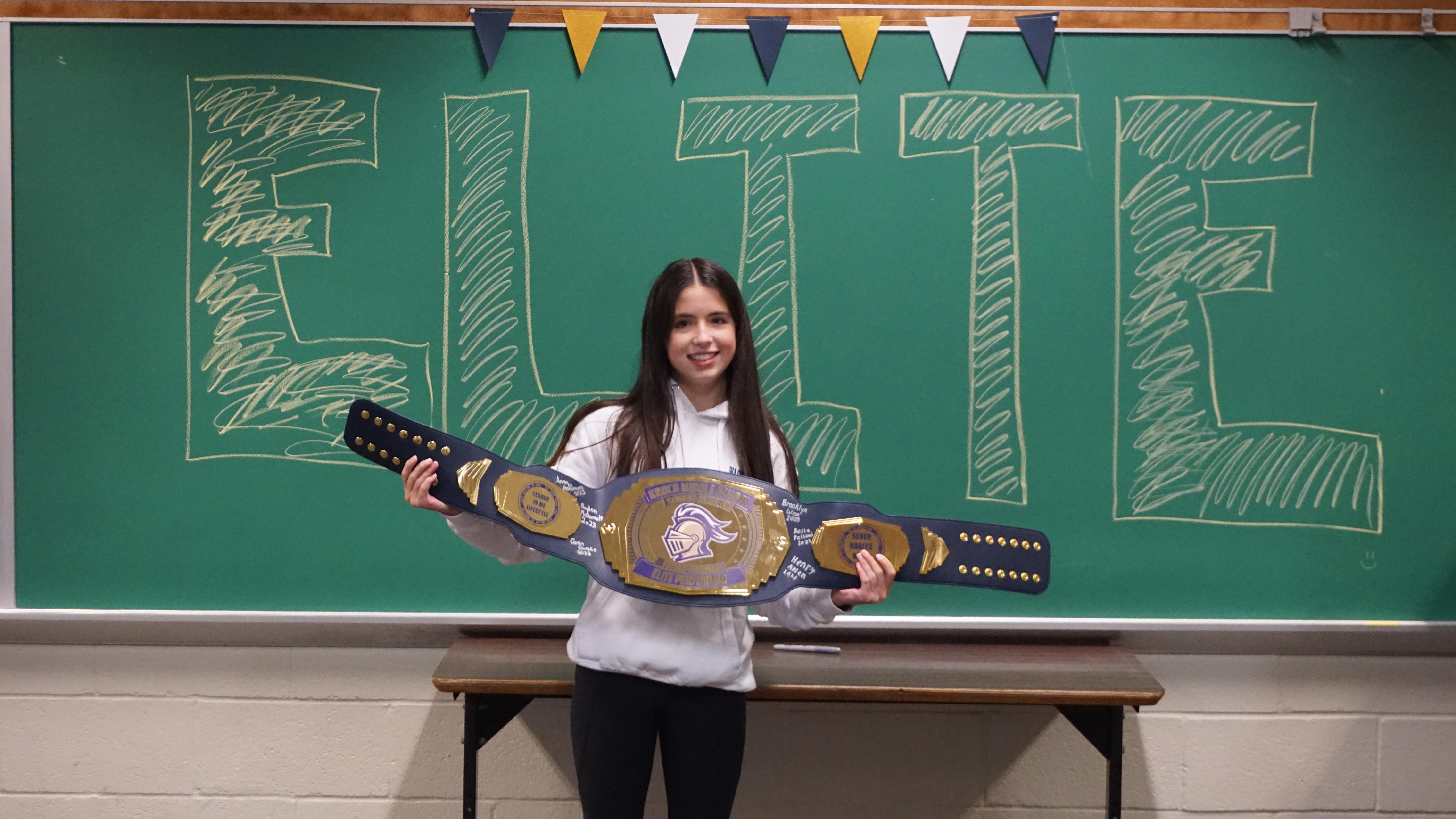 pic of a girl with a huge prize belt